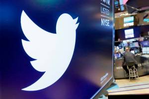 FILE - In this Feb. 8, 2018, file photo, the logo for Twitter is displayed above a trading post on the floor of the New York Stock Exchange.  Twitter is imposing new rules, Friday, Oct. 9, 2020,  ahead of the U.S. presidential election, prohibiting people,  including candidates, from claiming an election win before it is called by either state election officials or two authoritative, national news outlets. (AP Photo/Richard Drew, File)