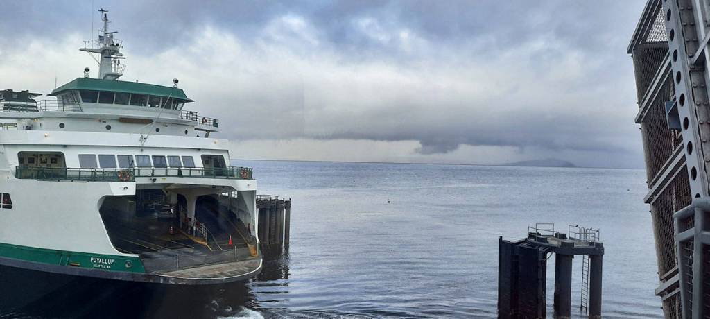Edmonds ferry terminal worker Leslie Saber took this photo as the boat pulled into the dock, minutes before a lightning strike Saturday afternoon that toppled her to her knees. Saber, who is also a professional photographer, said she took the picture because of the stormy background. (Leslie Saber)