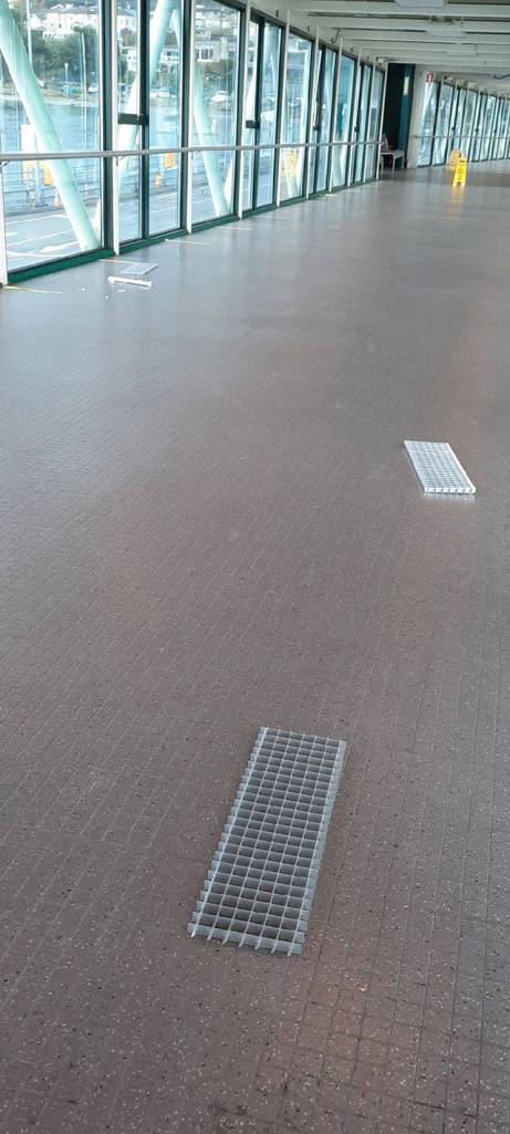 Saturdays lightning strike at the Edmonds terminal knocked the covers off light fixtures and broke bulbs in the overhead passenger loading walkway. (Leslie Staber)