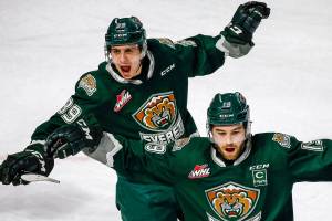 Everett's Gage Goncalves (left) and Everett's Bryce Kindopp celebrates a goal against Seattle Sunday evening at ShoWare Center in Kent on March 8, 2020. The Silvertips won 3-2. (Kevin Clark / The Herald)