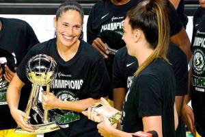 Seattle Storm guard Sue Bird, left, smiles at Breanna Stewart after the team defeated the Las Vegas Aces to win basketballs WNBA championship last week in Bradenton, Fla. (AP Photo/Chris OMeara)