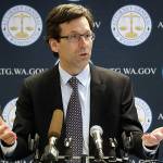 Washington state Attorney General Bob Ferguson, center, speaks as King County Prosecuting Attorney Dan Satterberg, left, and Thurston County Prosecuting Attorney Jon Tunheim look on during a news conference about Ferguson's lawsuit challenging a Trump Administration practice of ICE arrests at courthouses Tuesday, Dec. 17, 2019, in Seattle. Washington state has sued the Trump administration over its practice of arresting people at courthouses for immigration violations, saying it interferes with the state's authority to run its own judicial system. (AP Photo/Elaine Thompson)