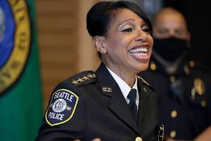 Seattle Police Chief Carmen Best laughs during a light moment at a news conference, Tuesday, Aug. 11, 2020, in Seattle. Best, the first Black woman to lead Seattle's police department, announced she will be stepping down in September following cuts to her budget that would reduce the department by as many as 100 officers. (AP Photo/Ted S. Warren)