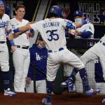 Los Angeles Dodgers' Cody Bellinger celebrates his two-run home run against the Tampa Bay Rays during the fourth inning in Game 1 of the baseball World Series Tuesday, Oct. 20, 2020, in Arlington, Texas. (AP Photo/Tony Gutierrez)