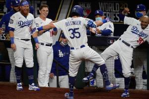 Los Angeles Dodgers' Cody Bellinger celebrates his two-run home run against the Tampa Bay Rays during the fourth inning in Game 1 of the baseball World Series Tuesday, Oct. 20, 2020, in Arlington, Texas. (AP Photo/Tony Gutierrez)