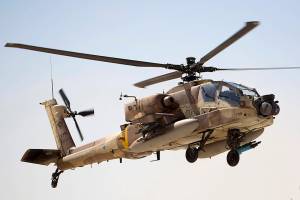 An Israeli Air Force Boeing AH-64 Apache attack helicopter from the 113th Squadron, also known as the Hornet Squadron, lands during a display for the foreign press in Ramon air force base near the Israeli town of Mitzpe Ramon, in the Negev desert, southern Israel, Monday, Oct. 21, 2013.(AP Photo/Ariel Schalit)