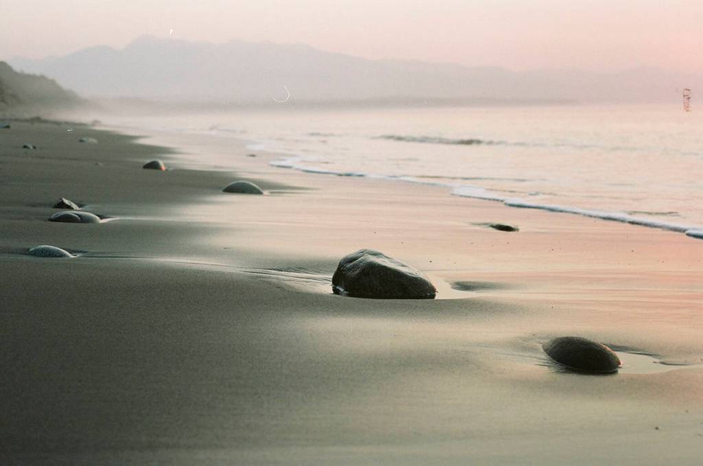 The combination of wildfire smoke high in the atmosphere and sunset colors made for a watercolor-like effect in film. This photo is of Dungeness Spit near Sequim. (Christina Hickman)
