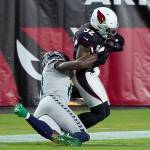 Seattle Seahawks wide receiver DK Metcalf tackles Arizona Cardinals strong safety Budda Baker (32) short of the goal line Sunday, ending an epic pursuit that began with Baker intercepting a pass at the Arizona 2. (Associated Press)
