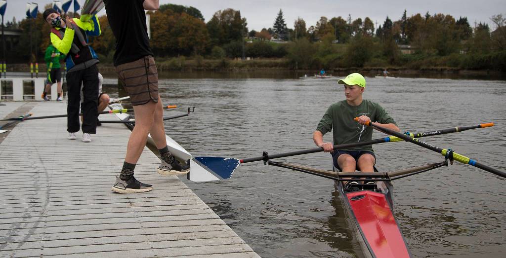 Ray Johnson gets a helping foot from Garrett Urvater to cast away from the dock. (Andy Bronson / The Herald)