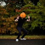 Brett Kelly poses as Pumpkin Man, his TikTok character, in Lake Stevens. (Olivia Vanni / The Herald)