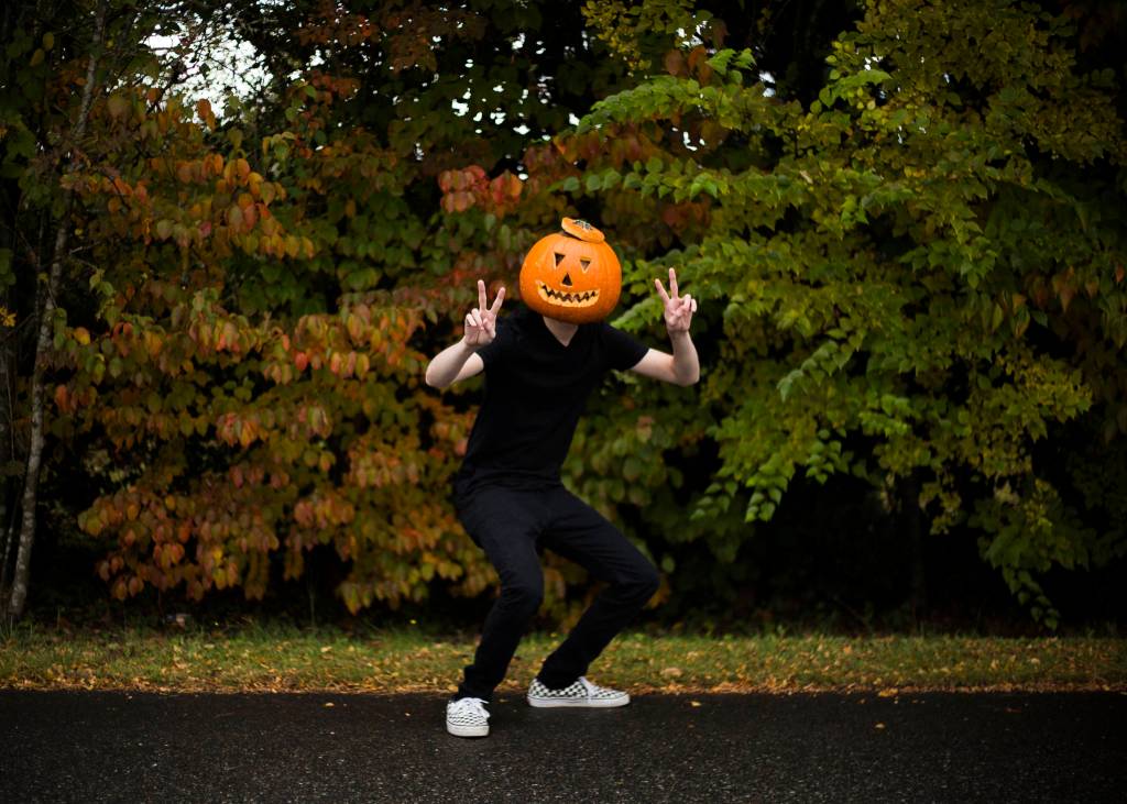 Brett Kelly poses as Pumpkin Man, his TikTok character, in Lake Stevens. (Olivia Vanni / The Herald)