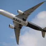 FILE - In this June 17, 2015 file photo, an Airbus A350 performs a demonstration flight at the Paris Air Show, in Le Bourget airport, north of Paris. Airbus announced Wednesday Jan. 11, 2017 that it delivered 688 planes over the year, primarily in the single-aisle A320 family, compared with 635 in 2015. The company increased deliveries of its long-delayed A350 wide-body. (AP Photo/Francois Mori, File)