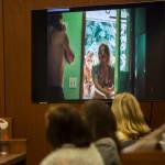 A photo of Jody Loomis and neighbor Linda Hook is shown during Hooks testimony Wednesday in Everett. (Olivia Vanni / The Herald)