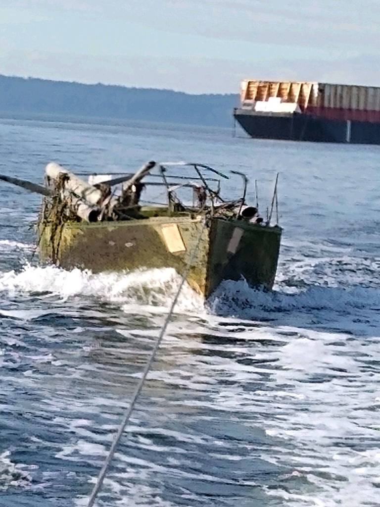 An old sailboat was hauled away from Jetty Island on Oct. 21. (Snohomish County Surface Water Management)