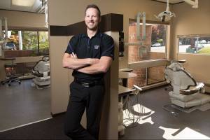 Dr. Kale Eckland, along with his two brothers are local dentists. He and his two brothers developed a private dental plan while their offices were shut due to COVID-19 this spring.  Dr. Eckland's plan is also for people who've lost their jobs or are retired and still want to make sure they're teeth are taken care. Adult plans run about $70 per month. At his Everett office on Wednesday, Oct. 28, 2020 in Everett, Washington.  (Andy Bronson / The Herald)