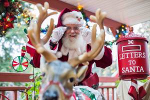 George Smith, who has been Santa Claus for more than 13 years, at his decorated home on Wednesday, Nov. 11, 2020 in Lynnwood, Wa. (Olivia Vanni / The Herald)