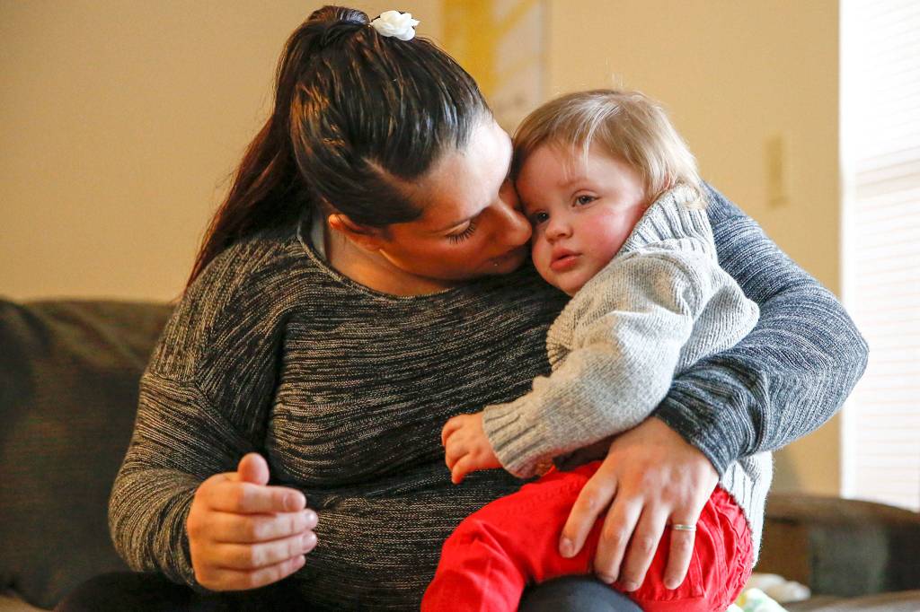 Ashlie Belt and her year-old son, Kaiden Hoffman, were among clients who were helped by Pacific Treatment Alternatives housing program for women overcoming addiction, ESTEEM, which is losing a basic needs grant from United Way. (Kevin Clark / The Herald)
