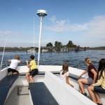 People ride the Jetty Island passenger ferry in August 2019 from Everett. The service could return next year if the city finds funding, as the city council has requested. (Lizz Giordano / Herald file)