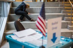 A voter fills out a ballot outside of the County Public Meeting Room on Tuesday, Nov. 3, 2020 in Everett, Wa. (Olivia Vanni / The Herald)