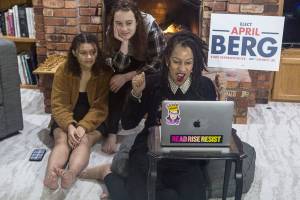 Washington State Representative candidate April Berg, right, and daughters Simone Nowak, 16, center, and Camille Nowak, 14, right, react to election results putting her ahead of Mark James on Tuesday, Nov. 3, 2020 in Mill Creek, Wa. (Olivia Vanni / The Herald)
