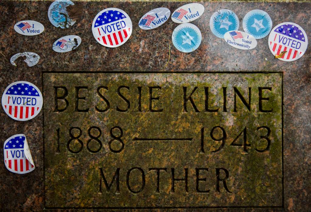 The gravestone of suffragist Bessie Kline covered in I Voted stickers at Evergreen Cemetery on Wednesday in Everett. (Olivia Vanni / The Herald)