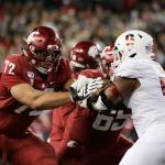 Washington State offensive lineman Abraham Lucas (left) and offensive lineman Josh Watson (center) block Stanford defensive end Jovan Swann during the second half of a game on Nov. 16, 2019, in Pullman. (AP Photo/Young Kwak)