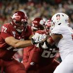 Washington State offensive lineman Abraham Lucas, left, and offensive lineman Josh Watson, center, block Stanford defensive end Jovan Swann during the second half of an NCAA college football game in Pullman, Wash., Saturday, Nov. 16, 2019. (AP Photo/Young Kwak)