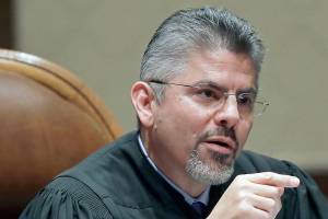 FILE - In this Jan. 22, 2019, file photo, Washington Supreme Court Justice Steven González listens to testimony during a hearing in Olympia, Wash. González has been elected as the next chief justice of the Washington state Supreme Court. He was elected by his colleagues on Thursday, Nov. 5, 2020, according to a news release sent by the court. (AP Photo/Ted S. Warren, File)