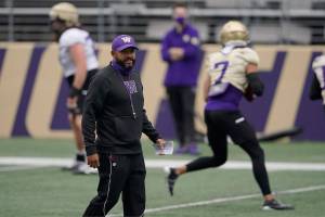 Washington head coach Jimmy Lake watches his team during NCAA college football practice, Friday, Oct. 16, 2020, in Seattle. (AP Photo/Ted S. Warren)