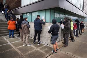 Voters stand in line to get their ballots at the Robert J. Drewel Administration Building on the 
Snohomsish County Campus on Tuesday, Nov. 3, 2020 in Everett, Washington.  (Andy Bronson / The Herald)