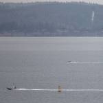 A police boat heads out across Possession Sound while the search for a Tulalip police officer missing from a capsized Tulalip fisheries boat continues on Wednesday, Nov. 18, 2020 in Everett, Wa. (Olivia Vanni / The Herald)