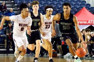 Marysville-Getchell's Malakhi Knight leads a fast break against Wilson Wednesday morning at the Tacoma Dome on March 4, 2020. Marysville-Gethchell lost to Wilson 73-52. (Kevin Clark / The Herald)