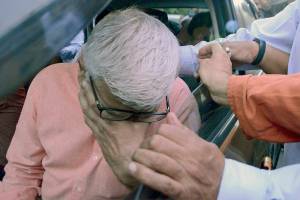 The father of Bhavye Suneja, one of the pilots of a Lion Air plane that crashed in Indonesia, reacts as he leaves for the airport in New Delhi, India, on Oct.29, 2018. The pilot's mother, Sangeeta Suneja, says the FAA and Boeing are bringing the 737 Max back to service prematurely. (AP Photo, file)