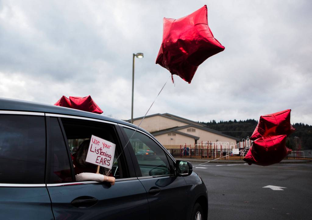 A sign on a car during a parade and rally in support of teachers on Thursday in Monroe. (Olivia Vanni / The Herald)