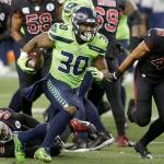 Seattle Seahawks running back Carlos Hyde (30) rushes against the Arizona Cardinals during the first half of an NFL football game, Thursday, Nov. 19, 2020, in Seattle. (AP Photo/Lindsey Wasson)