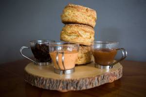 Biscuit and Bean offers buttermilk and cheddar onion biscuits along with a handful of spreads including bacon jam (left), Mamas Lil Pepper aioli (center) and apple butter. (Olivia Vanni / The Herald)
