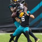Steelers linebacker Bud Dupree (back right) pushes past Jaguars offensive tackle Cam Robinson (back left), to sack quarterback Jake Luton during the second half of a game Nov. 22, 2020, in Jacksonville, Fla. (AP Photo/Gary McCullough)