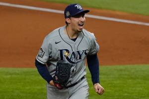 Tampa Bay Rays starting pitcher Blake Snell celebrates after striking out the side during the fourth inning in Game 6 of the baseball World Series Los Angeles Dodgers Tuesday, Oct. 27, 2020, in Arlington, Texas. (AP Photo/Tony Gutierrez)