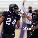 Washington's Kamari Pleasant (24) celebrates his touchdown with Terrell Bynum against Arizona during the second half of an NCAA college football game Saturday, Nov. 21, 2020, in Seattle. (AP Photo/Elaine Thompson)