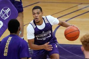 Washington's Quade Green dribbles during an NCAA college basketball practice Tuesday, Oct. 27, 2020, in Seattle. (AP Photo/Elaine Thompson)