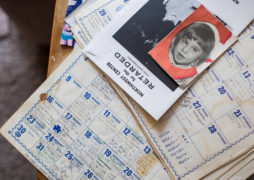 A photograph of Janet Taggarts daughter, Naida, sits on top of her old calendars filled with appointments and notes in her home. (Olivia Vanni / The Herald)