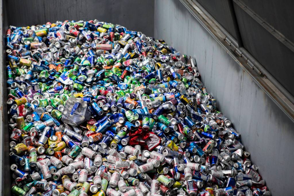 Aluminum cans fill a large recycling container at the Airport Road Recycling & Transfer Station on Nov. 24 in Everett. (Olivia Vanni / The Herald)