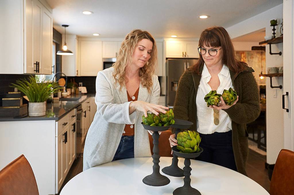 Twins Leslie Davis, left, and Lyndsay Lamb stage a house in Everett as seen on Unsellable Houses on HGTV. (HGTV photo)