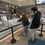 Amethyst Skeels and Alexander Walsh pick out cannabis products at Kushman's Everett Cannabis Dispensary on Evergreen Way on Tuesday, Dec. 1, 2020 in Everett, Washington.  (Andy Bronson / The Herald)