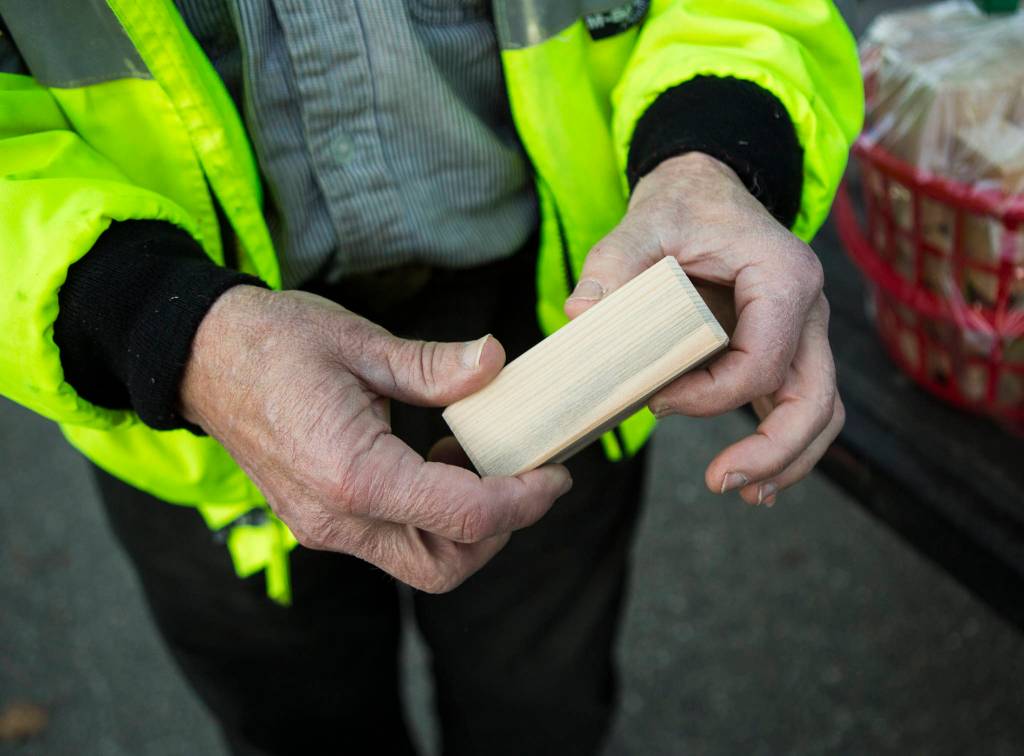 Jon Wilson shows one of the hand-crafted blocks on Wednesday in Monroe. (Olivia Vanni / The Herald)