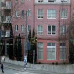 A lone man walks a dog, Tuesday, March 24, 2020, near apartments in Seattle's Capitol Hill neighborhood. Washington Gov. Jay Inslee on Monday, March 23, 2020, ordered nonessential businesses to close and the state's more than 7 million residents to stay home in efforts to slow the spread of the new coronavirus. The new coronavirus causes mild or moderate symptoms for most people, but for some, especially older adults and people with existing health problems, it can cause more severe illness or death. (AP Photo/Ted S. Warren)