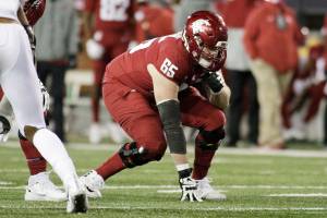 Washington State offensive lineman Josh Watson (65) lines up for a play during the second half of an NCAA college football game against Oregon in Pullman, Wash., Saturday, Nov. 14, 2020. Oregon won 43-29. (AP Photo/Young Kwak)