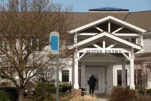 A woman walk up to closed doors at the Josephine Caring Community on Wednesday, March 11, 2018 in Stanwood, Wa.(Andy Bronson / The Herald)