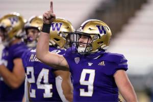 Washington quarterback Dylan Morris gestures after Washington defeated Utah 24-21 in an NCAA college football game Saturday, Nov. 28, 2020, in Seattle. (AP Photo/Ted S. Warren)