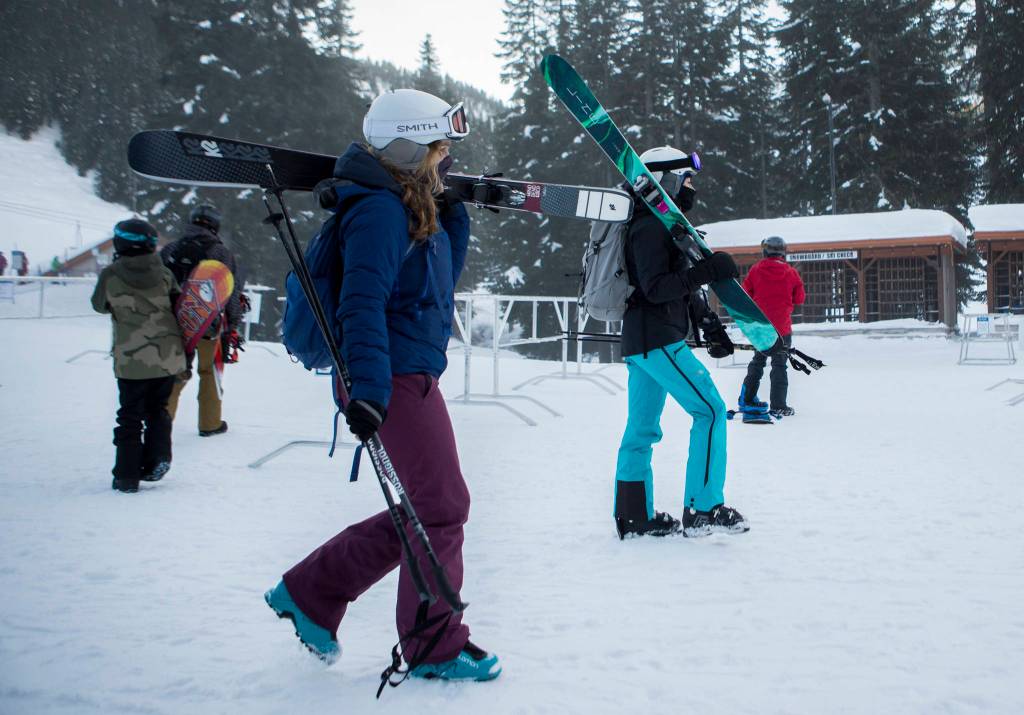 Skiers make their way to the lifts on opening day at Stevens Pass last Friday. (Olivia Vanni / The Herald)